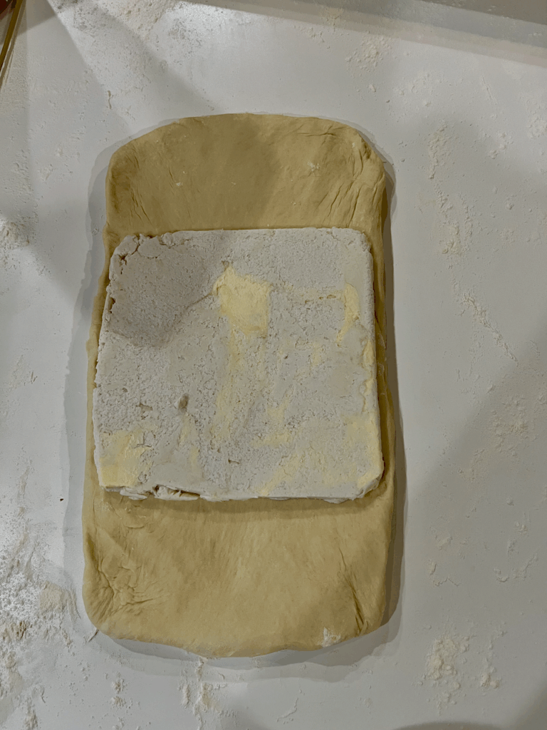 Butter brick laying on top of the dough rectangle